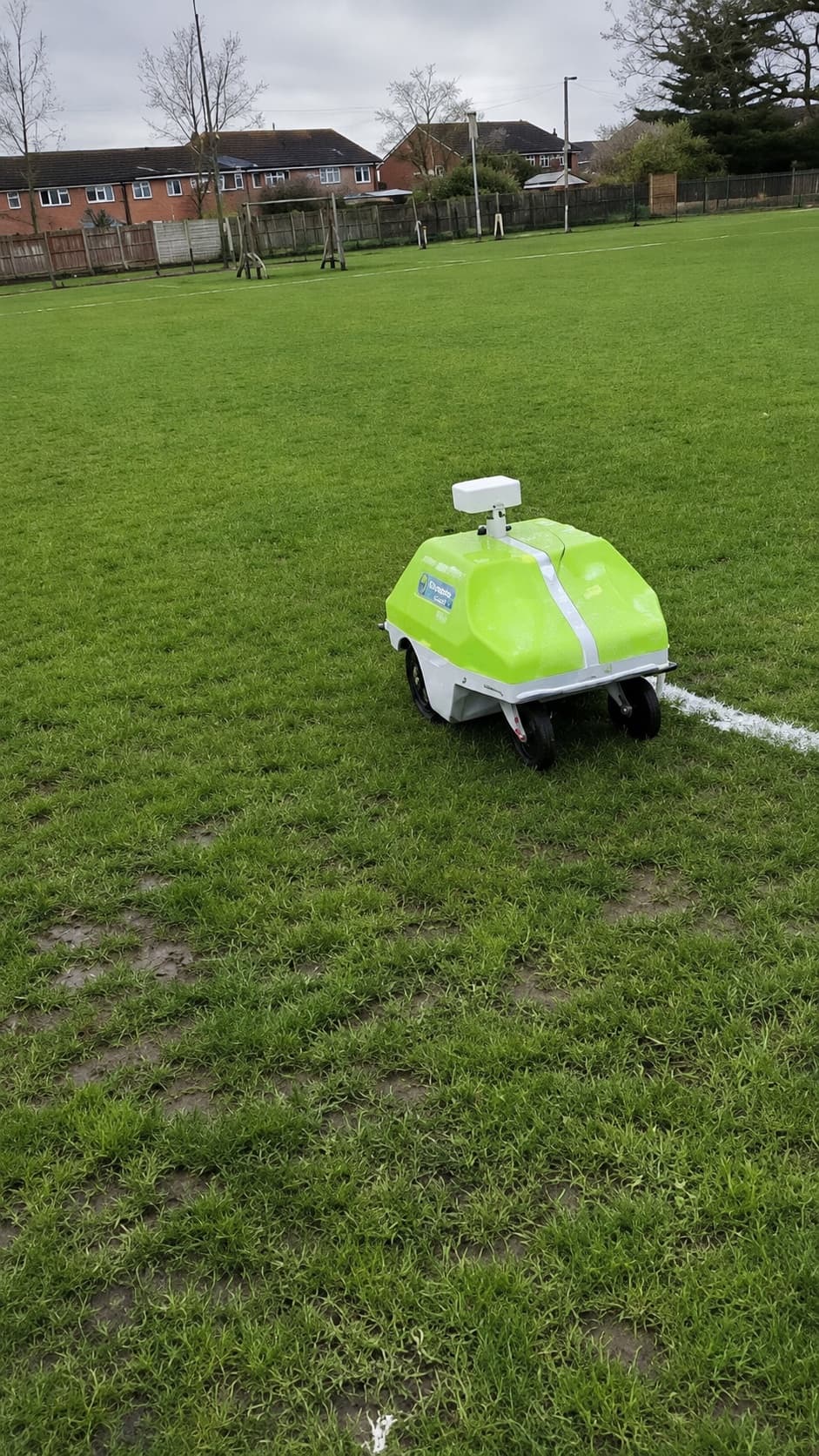 Robot line marker working across a wide grass playing field