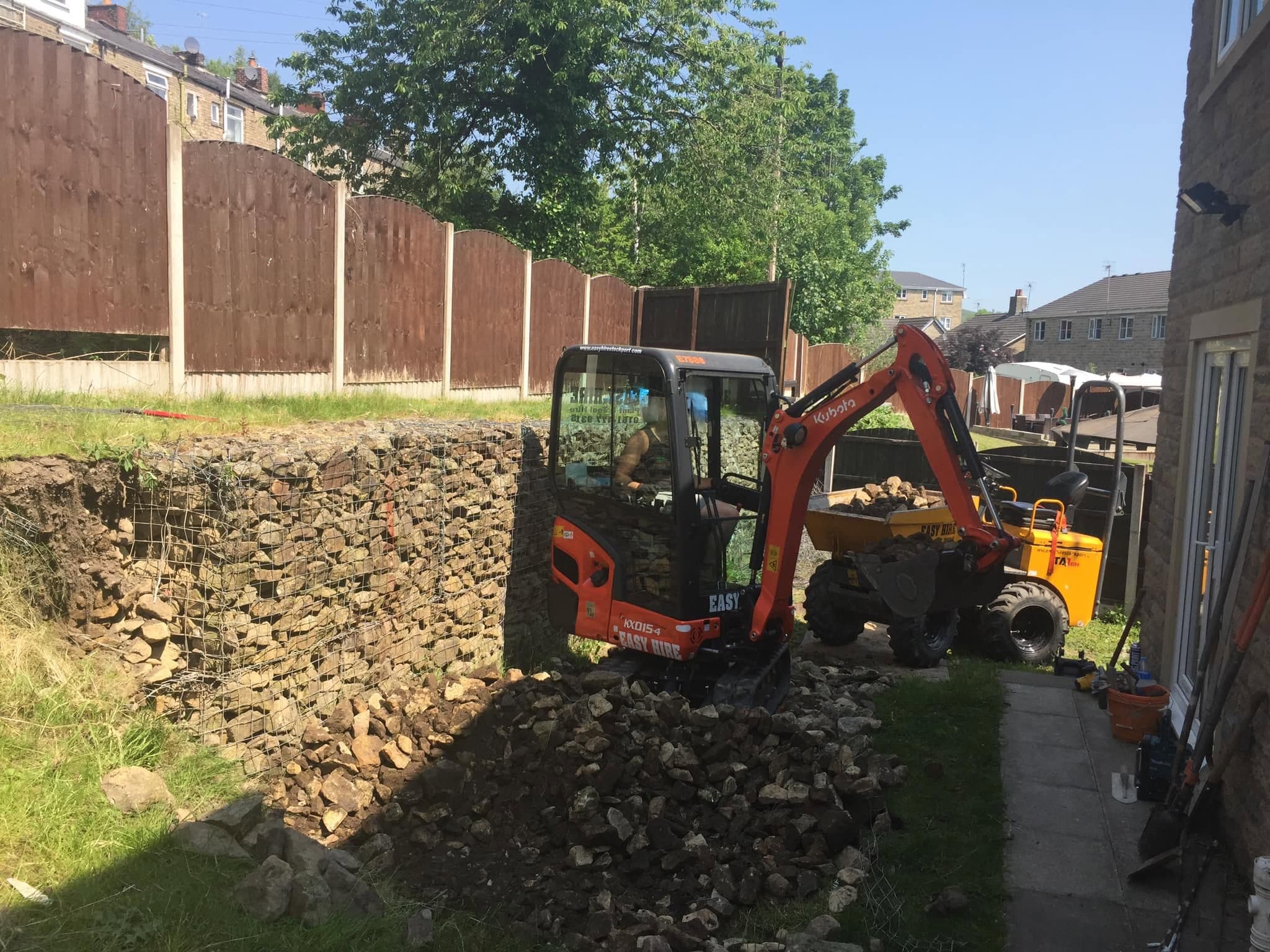 JG Groundcare mini digger working on a groundworks job