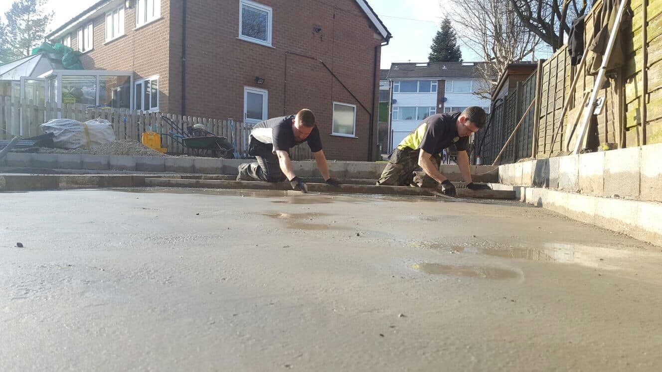 JG Groundcare team setting paving slabs