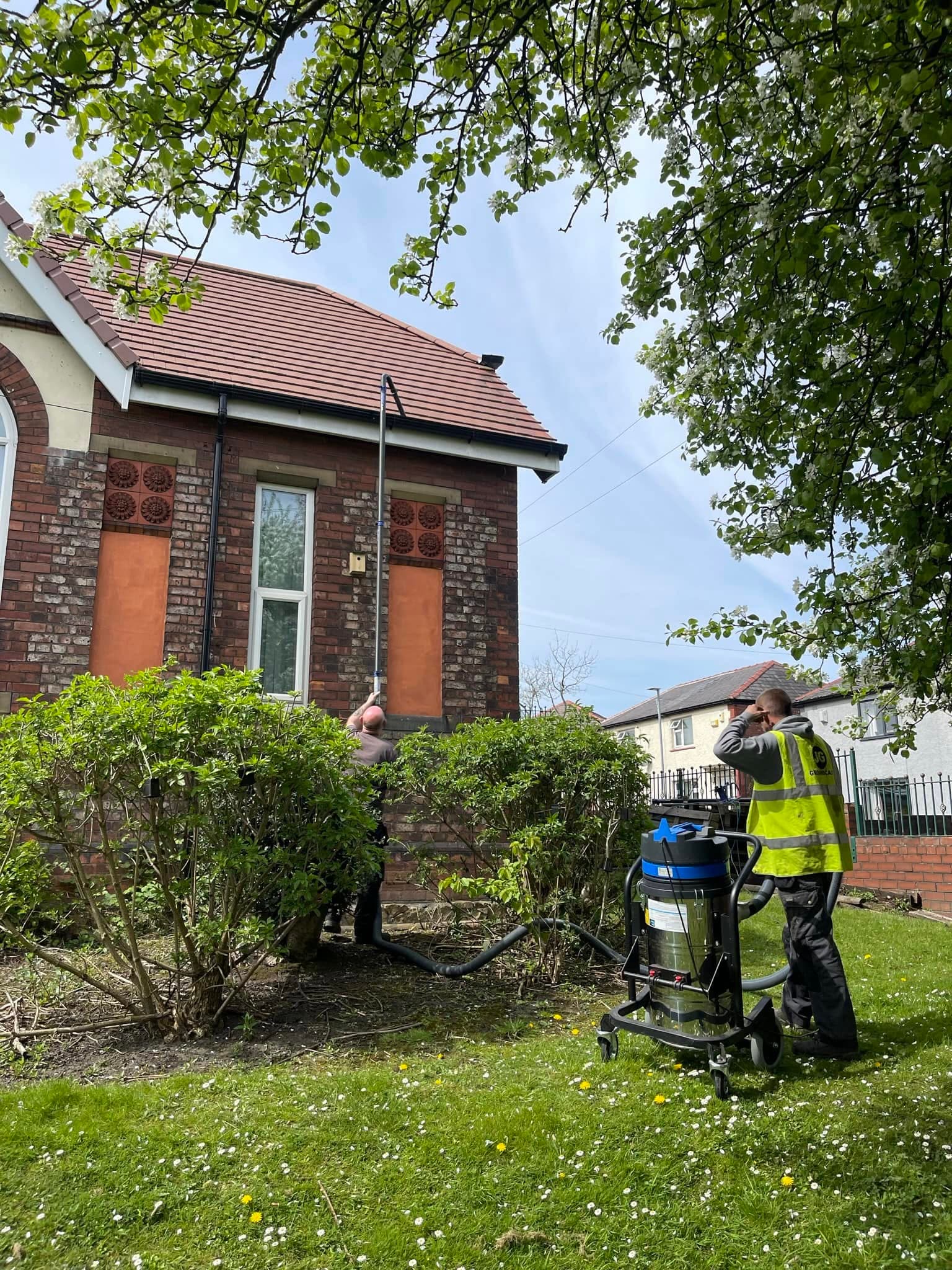 JG Groundcare operative in hi-vis on site